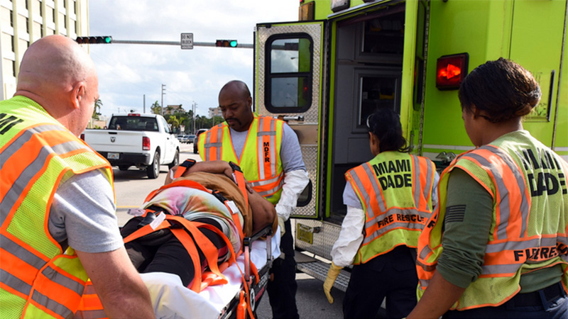 Fire Rescue with a man on a stretcher.