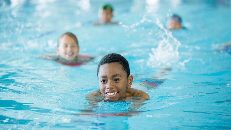 Kids swimming in a pool