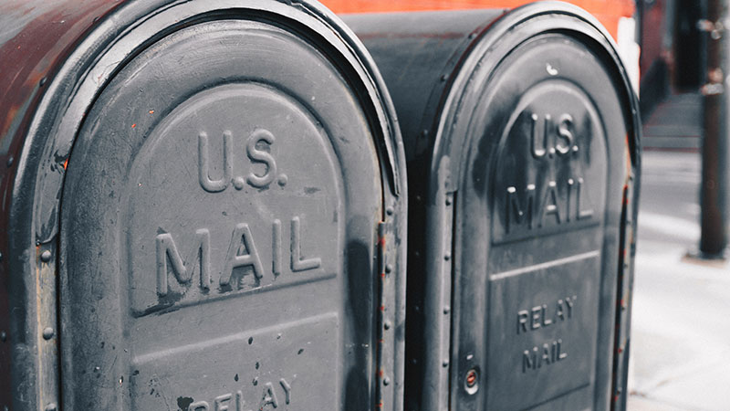 Two mailboxes side by side