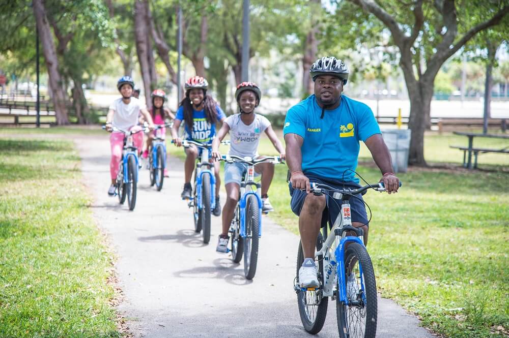 Youth safety bike ride with volunteer.