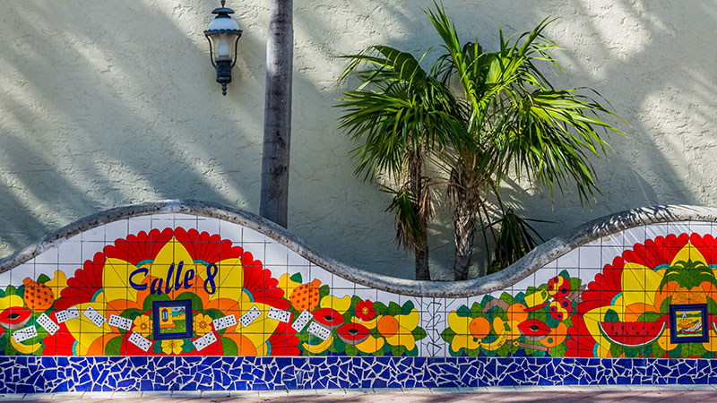 colorful mosaic wall, says calle ocho